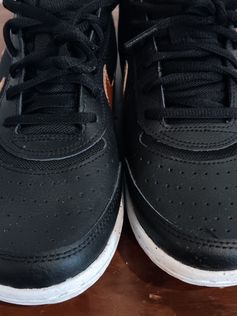 Nike Black Sneakers with White Midsole and Copper Swoosh